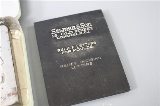 A cut steel seal matrix with the Royal Coat of Arms and engraved by appointment to HM The Queen, 6.5 x 7cm, with makers plaque of Sel